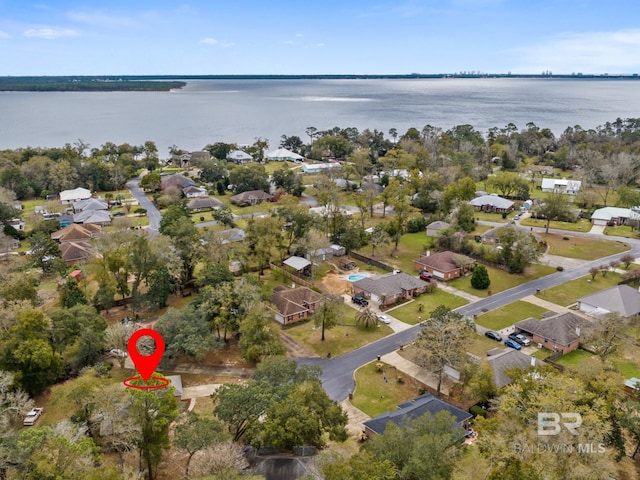 bird's eye view featuring a water view and a residential view