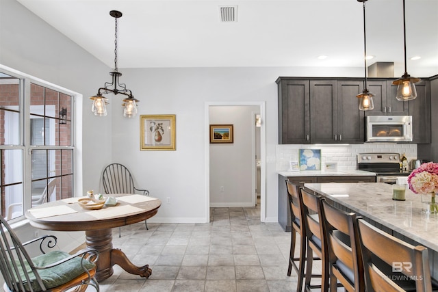 dining space featuring light tile patterned floors, recessed lighting, visible vents, baseboards, and an inviting chandelier