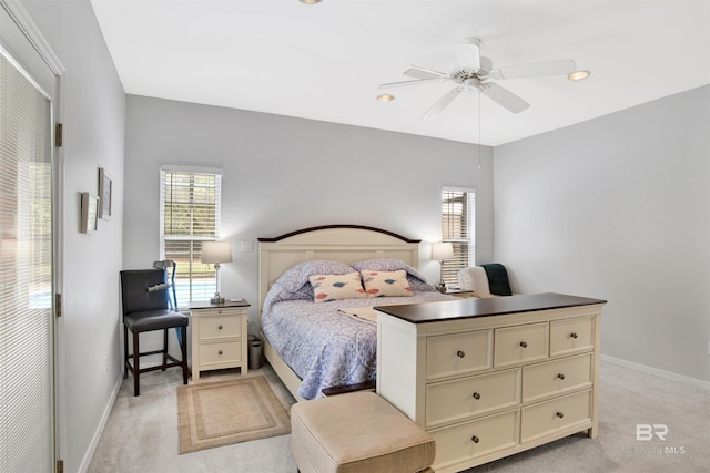 bedroom featuring light carpet, baseboards, and recessed lighting