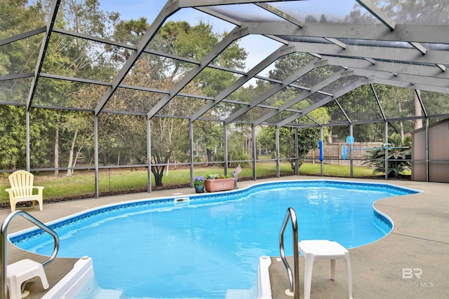 view of swimming pool featuring a lanai, fence, a fenced in pool, and a patio