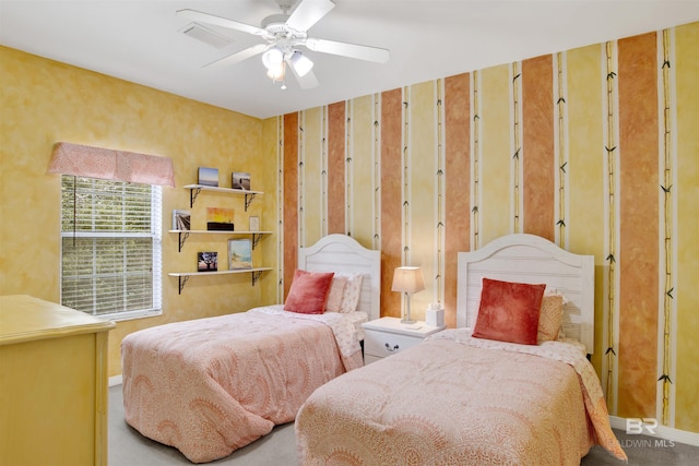 bedroom with ceiling fan, visible vents, and baseboards