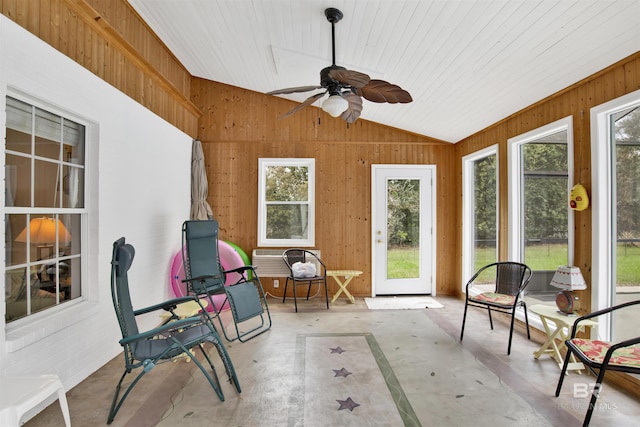 sunroom with lofted ceiling, ceiling fan, and wood ceiling