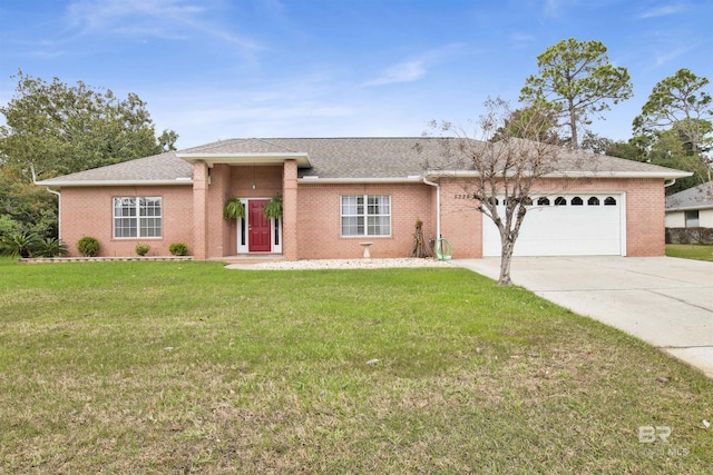 view of front facade with an attached garage, concrete driveway, brick siding, and a front yard