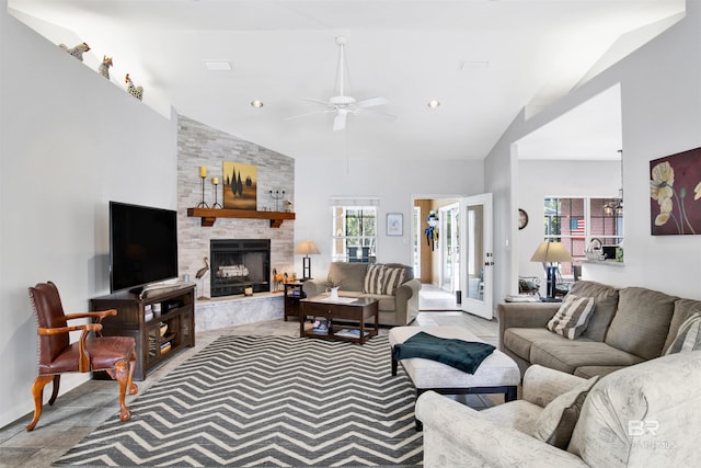 living room featuring ceiling fan with notable chandelier, high vaulted ceiling, a fireplace, and recessed lighting