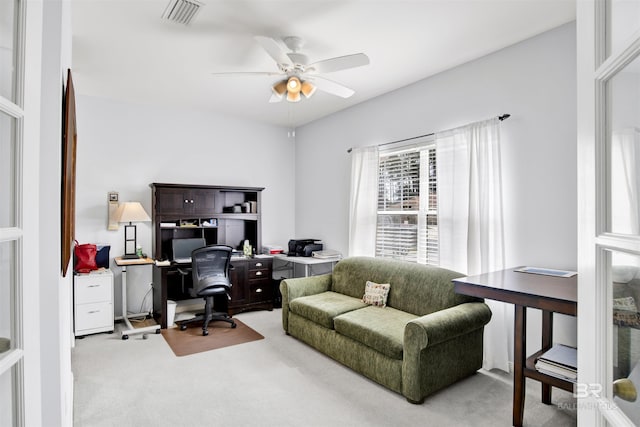 office space featuring a ceiling fan, carpet, and visible vents