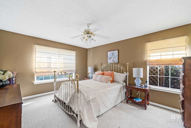 bedroom with carpet, baseboards, and ceiling fan