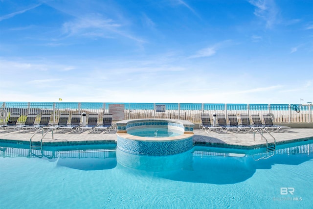 view of swimming pool with a community hot tub