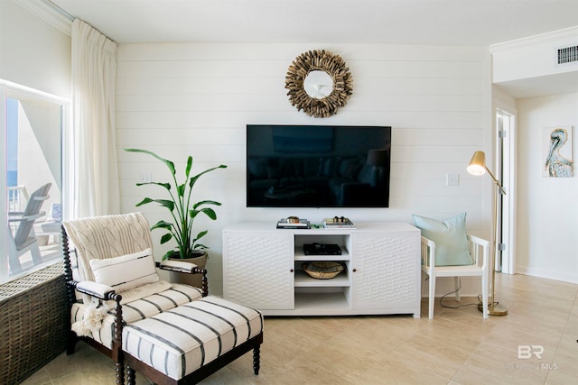 living area featuring light tile patterned floors and a wealth of natural light