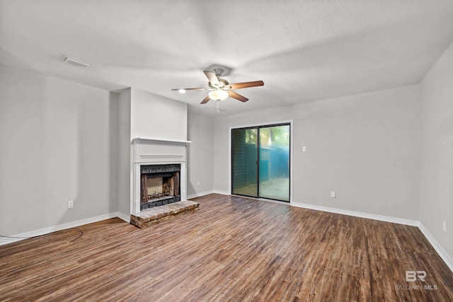 20 Summer Oaks Dr, Daphne, AL 36526 - unfurnished living room featuring a ceiling fan, a brick fireplace, and wood finished floors
