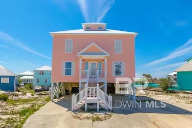 1492 Shell Ln, Gulf Shores, AL 36542 - view of front facade with stairs and covered porch