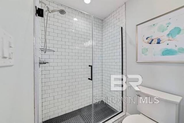 1492 Shell Ln, Gulf Shores, AL 36542 - full bathroom featuring toilet and a shower stall
