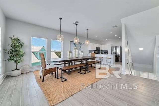 1492 Shell Ln, Gulf Shores, AL 36542 - dining space featuring light wood finished floors and recessed lighting