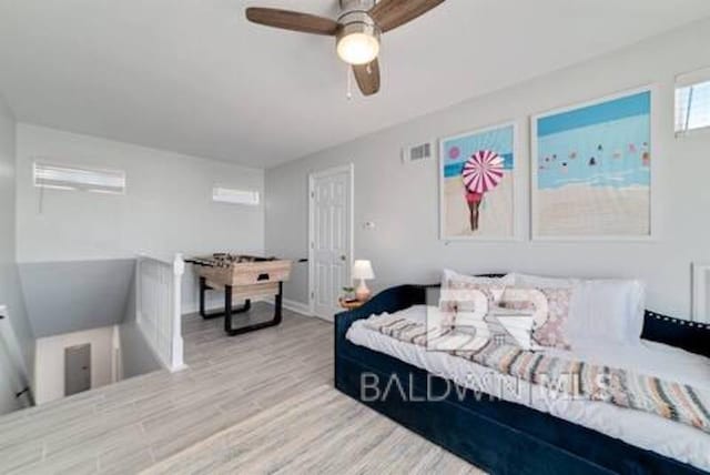 1492 Shell Ln, Gulf Shores, AL 36542 - bedroom featuring wood finished floors and ceiling fan