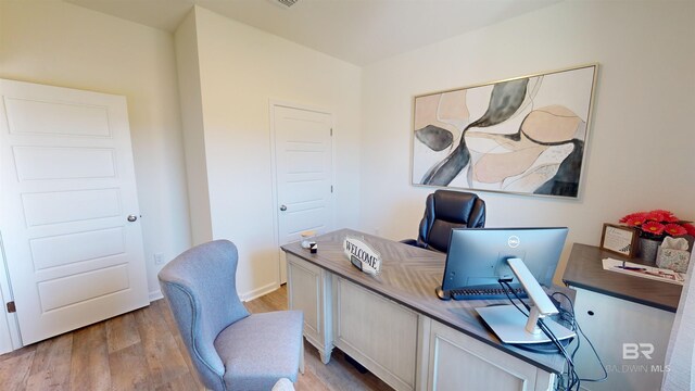 home office with light wood-type flooring