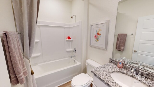 full bathroom with vanity, shower / bathtub combination, and toilet