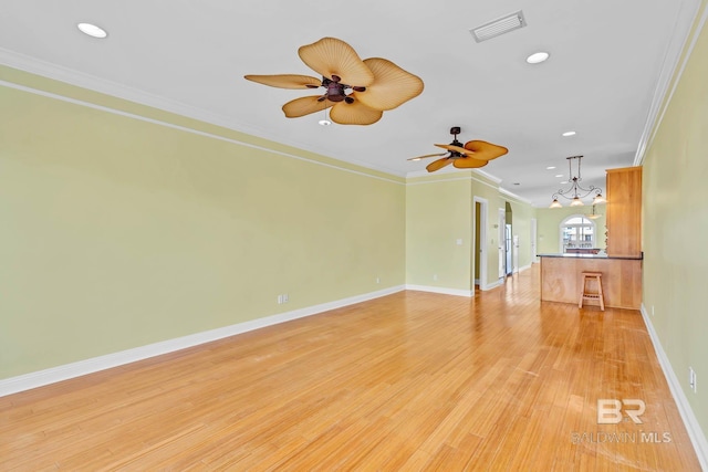 1328 W Lagoon Ave, Gulf Shores, AL 36542 - unfurnished living room featuring a ceiling fan, recessed lighting, a chandelier, crown molding, and light wood-style floors