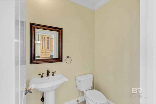 1328 W Lagoon Ave, Gulf Shores, AL 36542 - half bathroom featuring toilet and ornamental molding