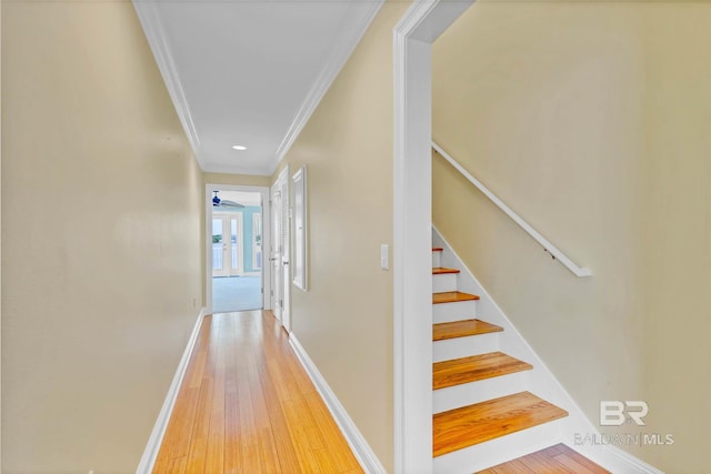 1328 W Lagoon Ave, Gulf Shores, AL 36542 - hallway featuring ornamental molding, light wood-style floors, and stairway