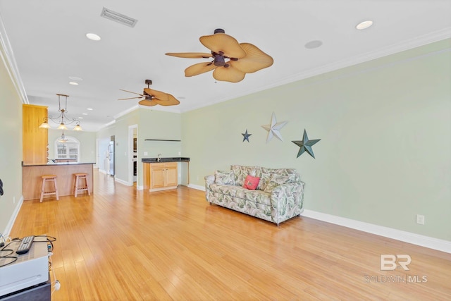 1328 W Lagoon Ave, Gulf Shores, AL 36542 - living area featuring ornamental molding, light wood finished floors, recessed lighting, and a ceiling fan