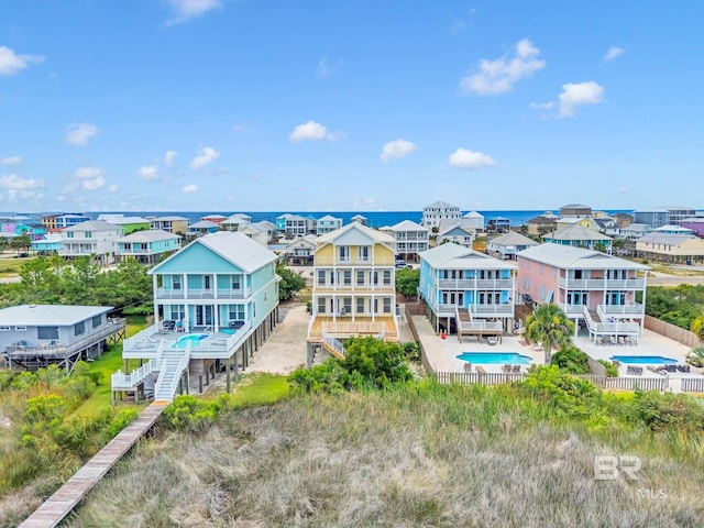 1328 W Lagoon Ave, Gulf Shores, AL 36542 - aerial perspective of suburban area with a pool area