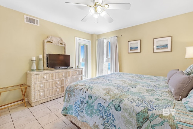 bedroom with light tile patterned floors, access to exterior, visible vents, and a ceiling fan