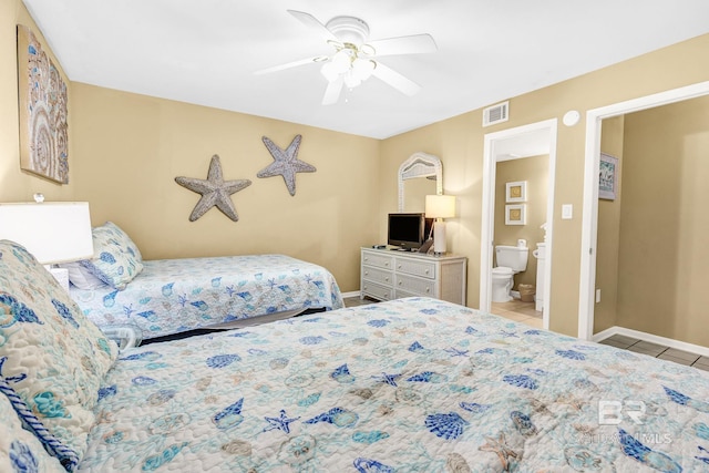 bedroom with light tile patterned floors, ceiling fan, connected bathroom, visible vents, and baseboards