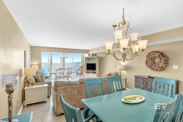 dining area with visible vents, a notable chandelier, and light tile patterned floors