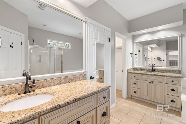 bathroom featuring vanity, an enclosed shower, and tile patterned flooring