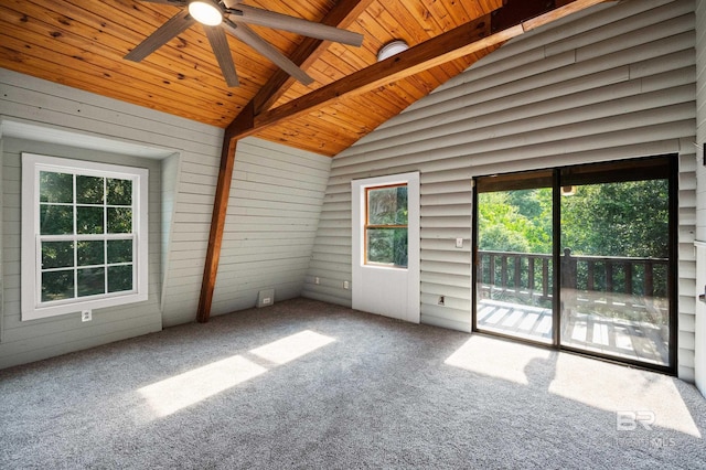 unfurnished sunroom featuring ceiling fan, lofted ceiling with beams, and wooden ceiling