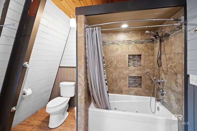 bathroom with shower / bathtub combination with curtain, wood-type flooring, and toilet