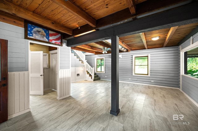 basement featuring wood ceiling and light hardwood / wood-style floors