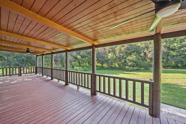deck featuring a yard and ceiling fan