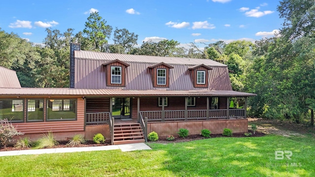 view of front of house featuring covered porch and a front yard