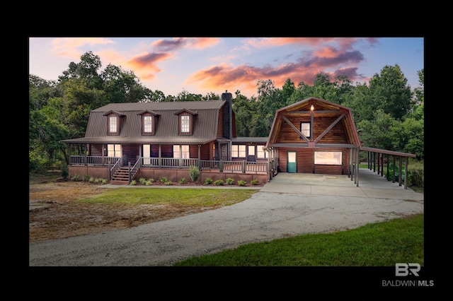view of front facade with a yard and covered porch