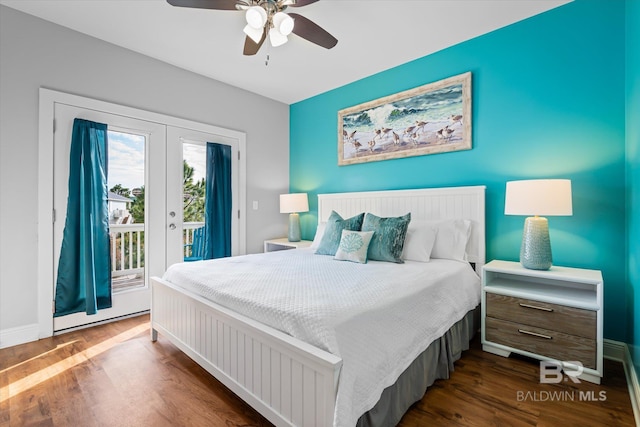 bedroom with access to outside, dark wood finished floors, a ceiling fan, and french doors