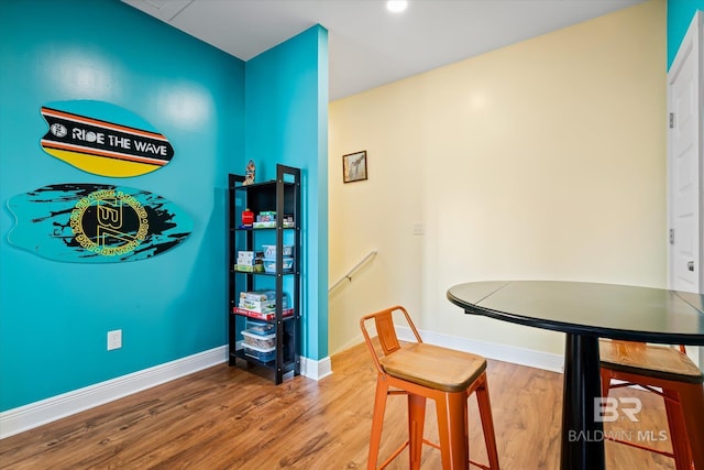 dining area with wood finished floors and baseboards