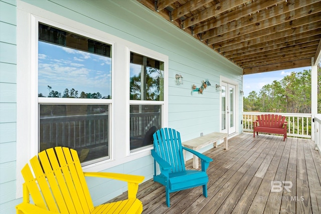 wooden deck featuring french doors