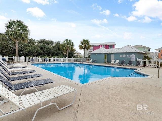 pool featuring a patio and fence