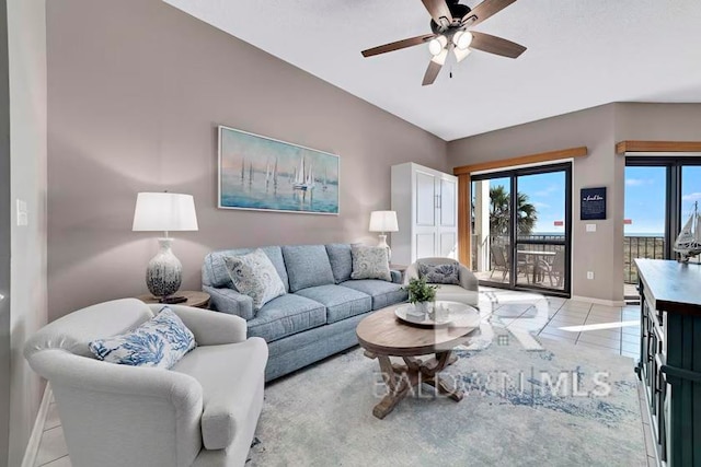 tiled living room featuring ceiling fan