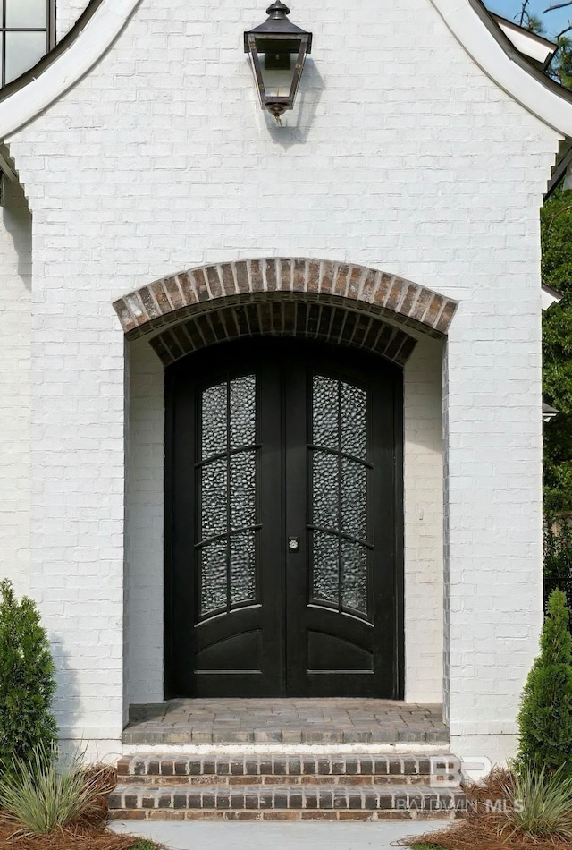 entrance to property featuring french doors