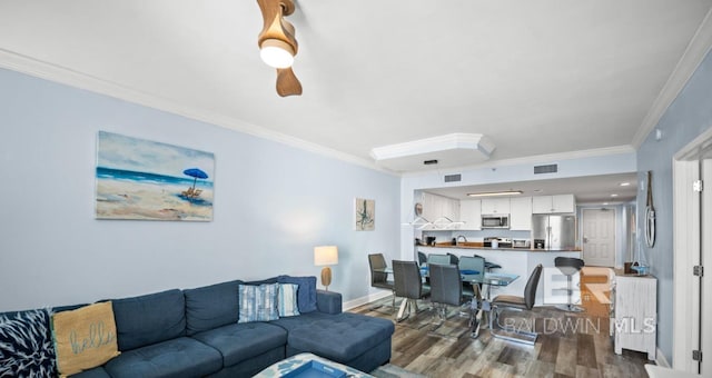 375 Beach Club Trl Unit A1704, Gulf Shores, AL 36542 - living room with dark wood-style flooring, crown molding, and baseboards