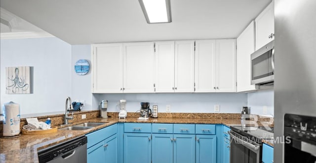 375 Beach Club Trl Unit A1704, Gulf Shores, AL 36542 - kitchen with stainless steel appliances, a sink, white cabinetry, and blue cabinets
