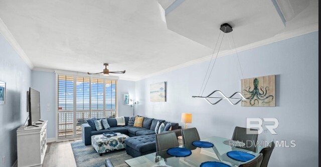 375 Beach Club Trl Unit A1704, Gulf Shores, AL 36542 - living room featuring crown molding, ceiling fan, wood finished floors, and baseboards