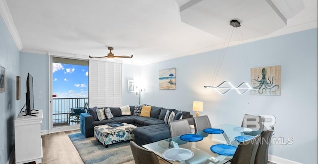 375 Beach Club Trl Unit A1704, Gulf Shores, AL 36542 - living area featuring crown molding, wood finished floors, a ceiling fan, and baseboards