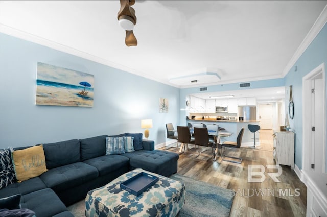 375 Beach Club Trl Unit A1704, Gulf Shores, AL 36542 - living area featuring wood finished floors, ornamental molding, and baseboards