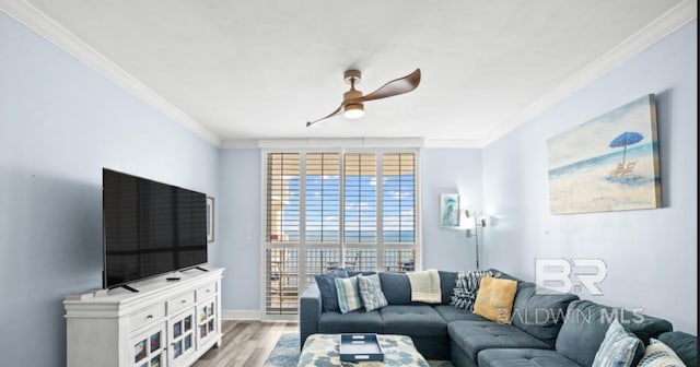 375 Beach Club Trl Unit A1704, Gulf Shores, AL 36542 - living room featuring crown molding, light wood-type flooring, a ceiling fan, and baseboards