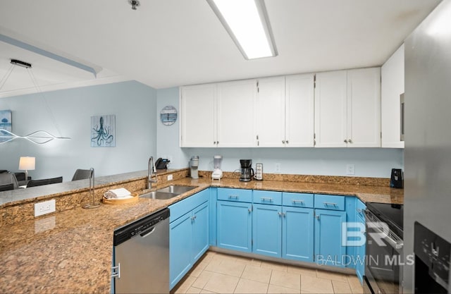 375 Beach Club Trl Unit A1704, Gulf Shores, AL 36542 - kitchen featuring appliances with stainless steel finishes, blue cabinets, a sink, white cabinets, and light tile patterned floors