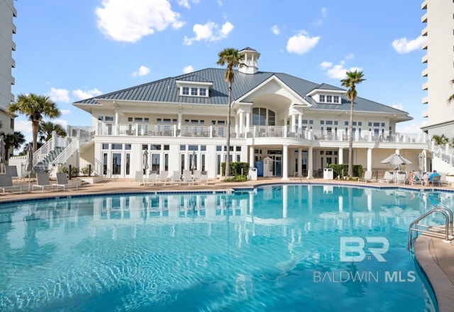 375 Beach Club Trl Unit A1704, Gulf Shores, AL 36542 - community pool featuring stairs and a patio