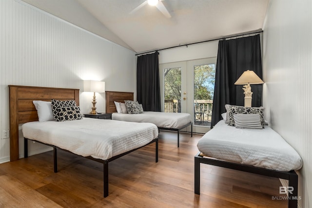 bedroom with wood finished floors, ceiling fan, access to exterior, vaulted ceiling, and french doors