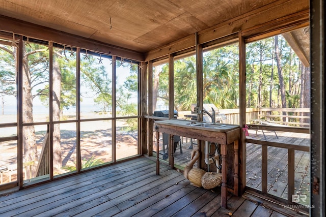 unfurnished sunroom featuring wooden ceiling